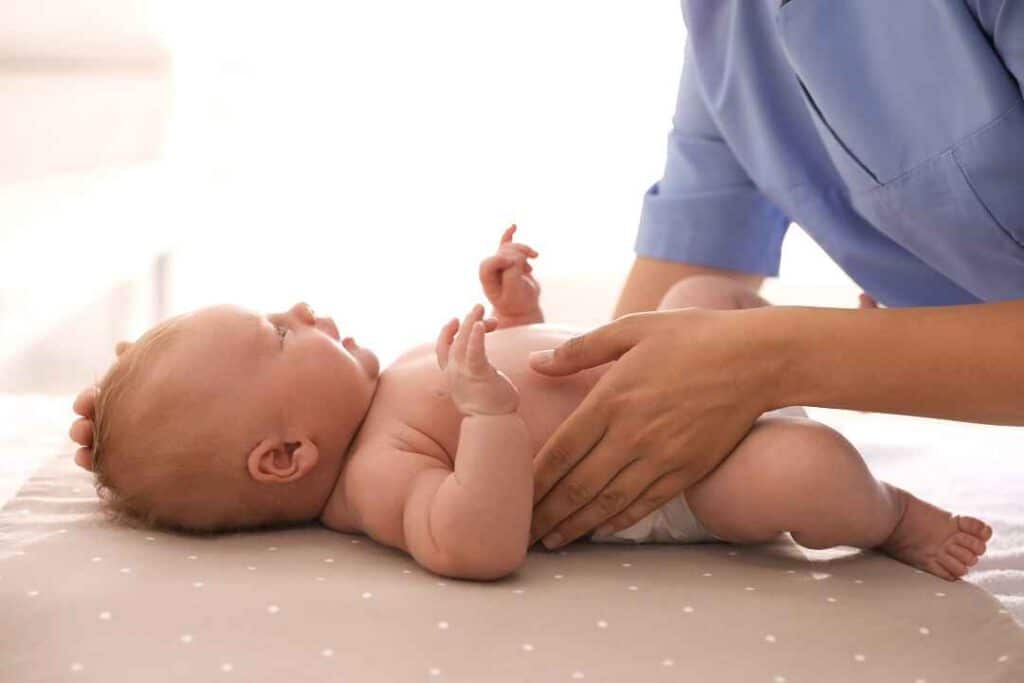Baby receiving gentle osteopathy treatment in North Vancouver at Active Therapy Clinic