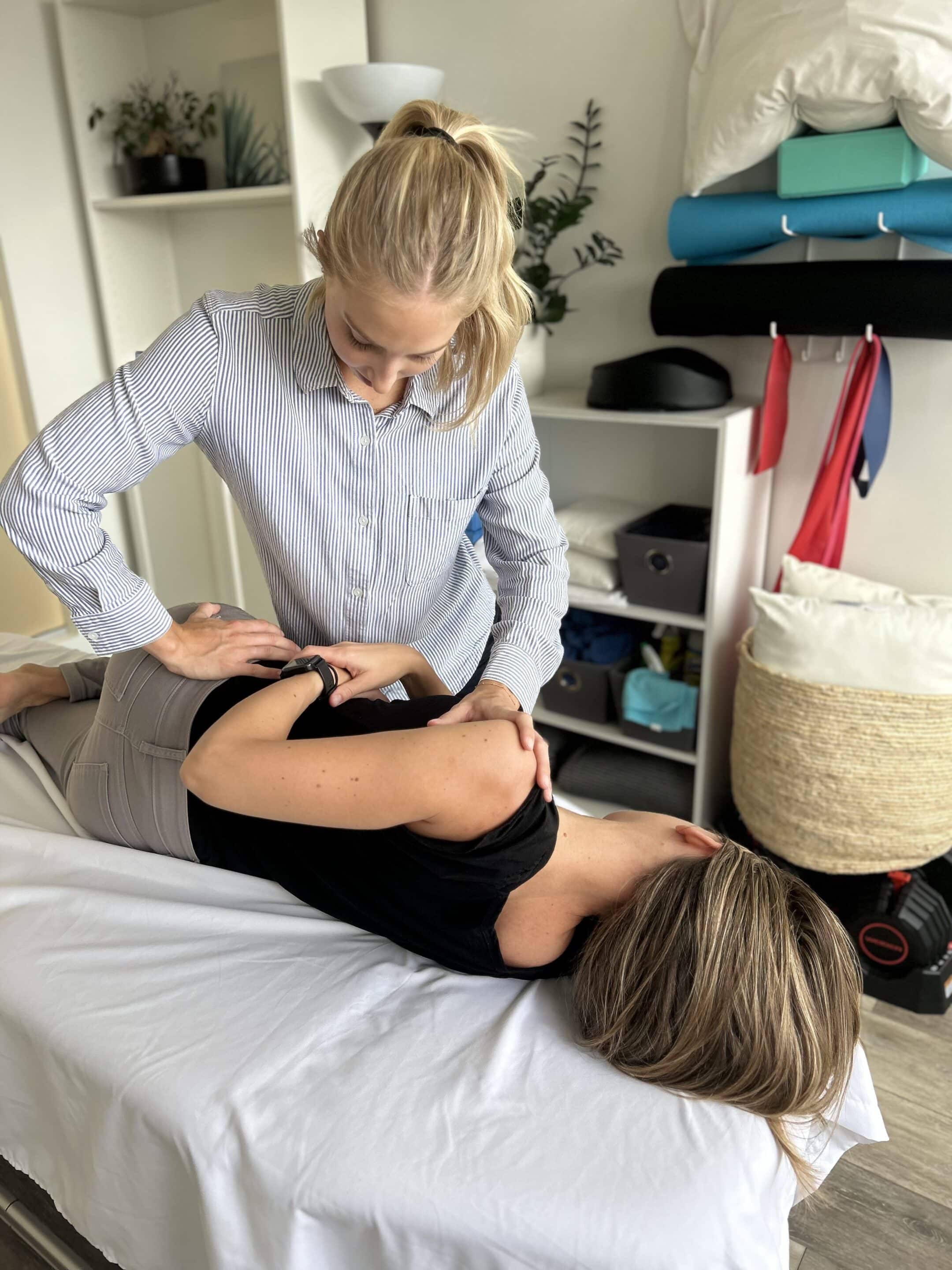 Jenna Mellor, Osteopathic Practitioner in North Vancouver, treating client with back pain